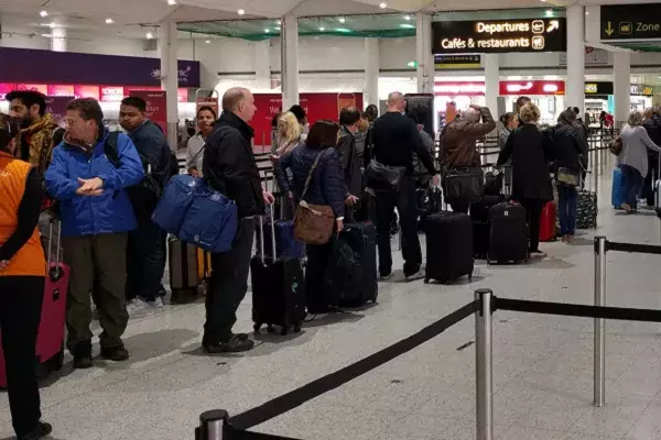 Queue of people at London Gatwick airport