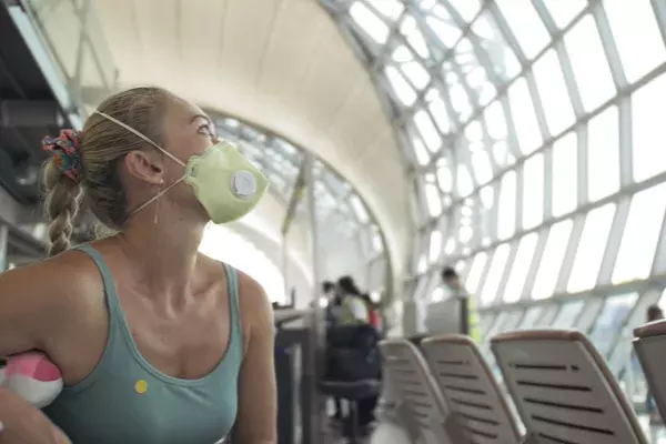 woman wearing mask in airport