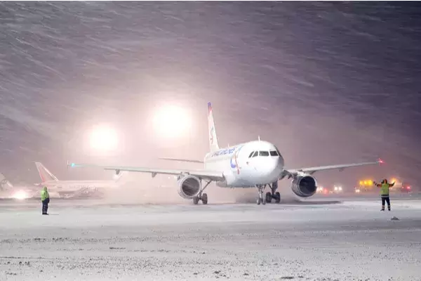 plane on runway in snow
