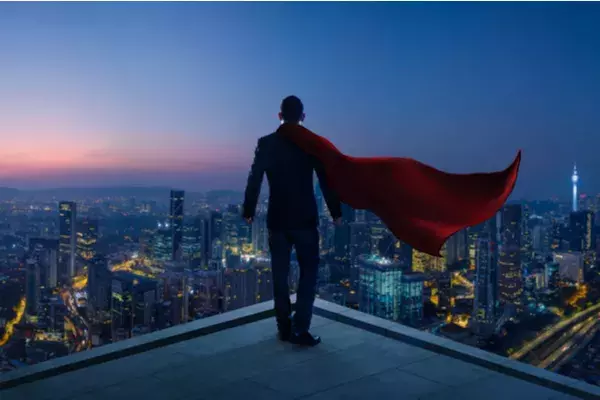 A superhero looking over a city skyline