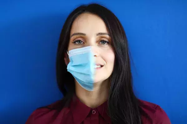 A before and after concept - a girl with a face mask covering half of her face