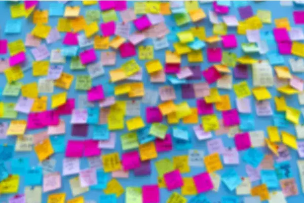 A wall covered in colourful post it notes