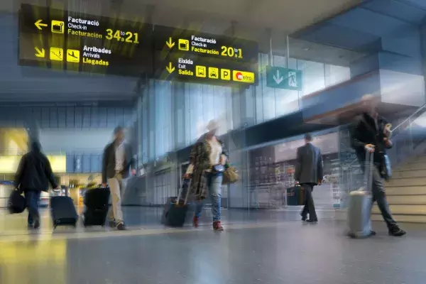 Airline passengers walking around airport