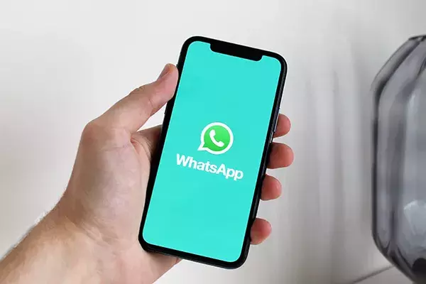 WhatsApp logo on a phone