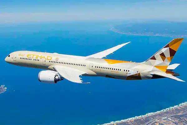 Etihad plane flying over the ocean